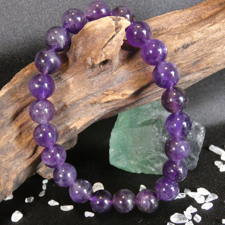 bracciale in Ametista con perle da 8 mm, ideale per protezione, intuizione e calma interiore.