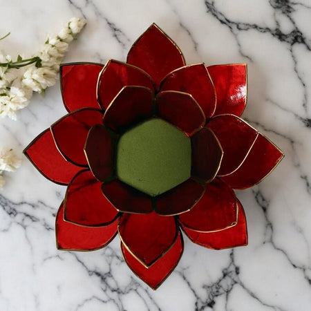 supporto candela chakra muladhara con luce calda e stile zen